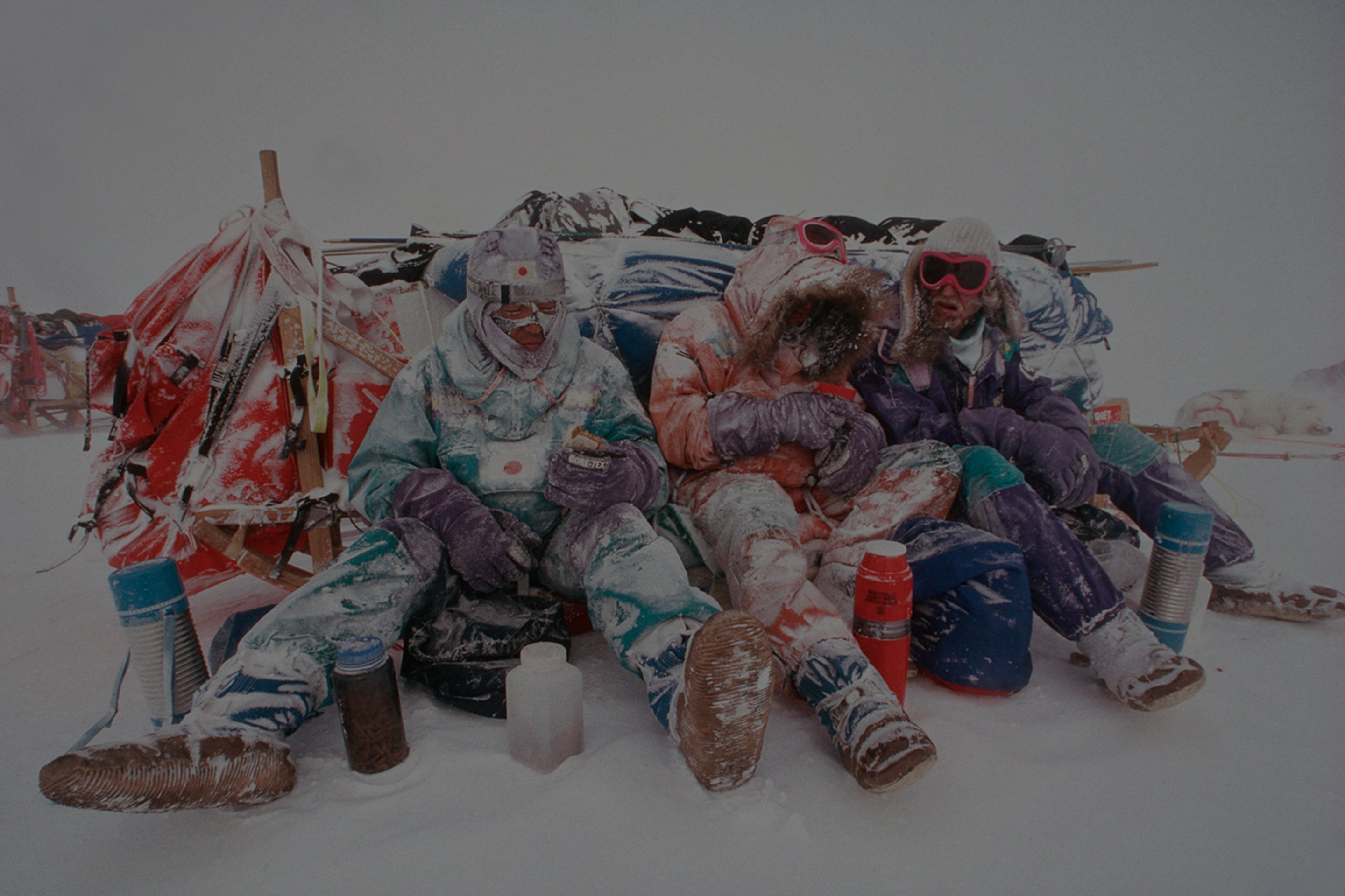The first trans-Antarctic dogsled team takes a break while completing their expedition.
