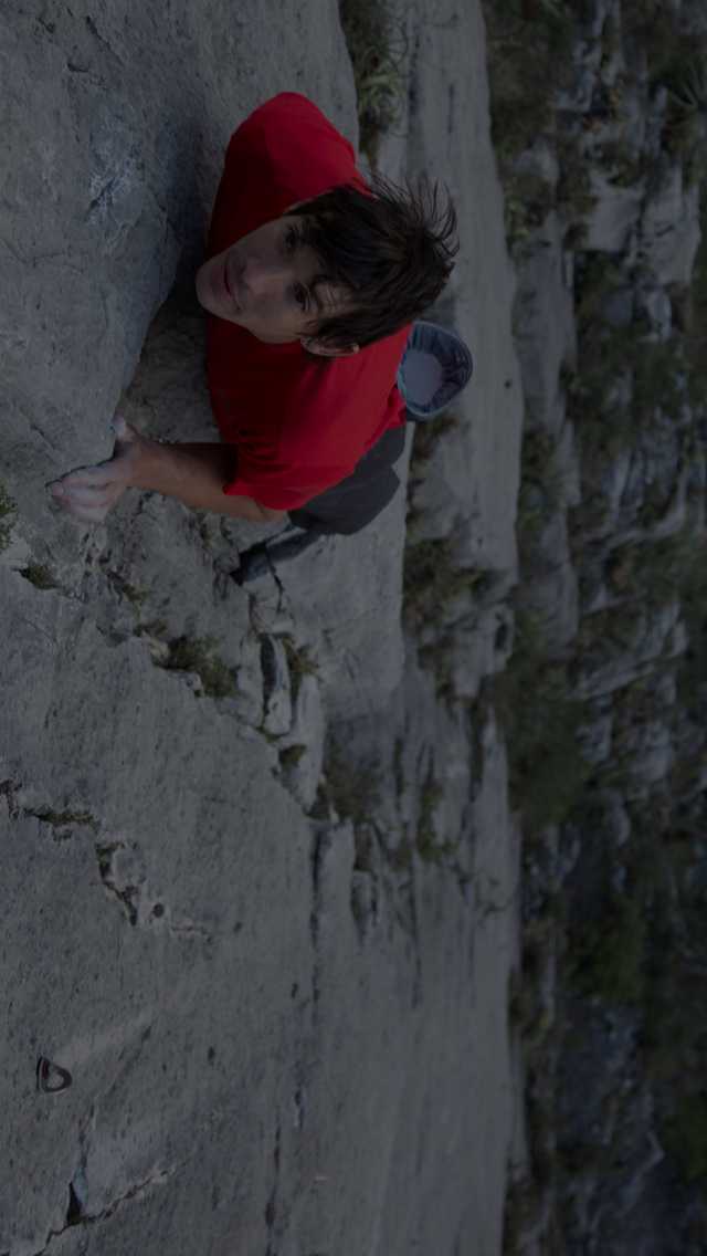Climber, Alex Honnold, visualizes his next move while completing the first free solo ascent of El Capitan.