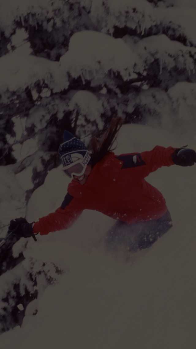 A skier smiles while testing out new products and equipment.
