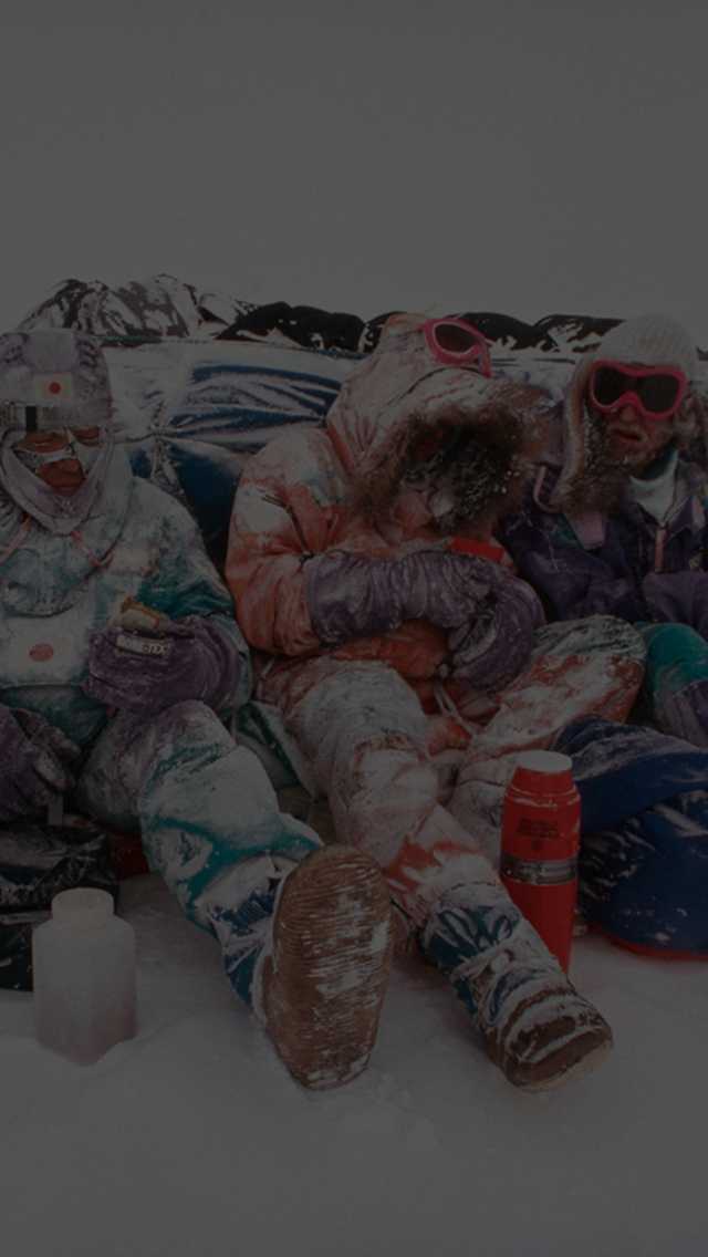 The first trans-Antarctic dogsled team takes a break while completing their expedition.
