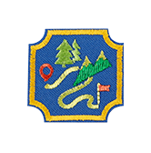 A Trail Adventure badge illustrates a winding road between mountains and trees and a waypoint flag.