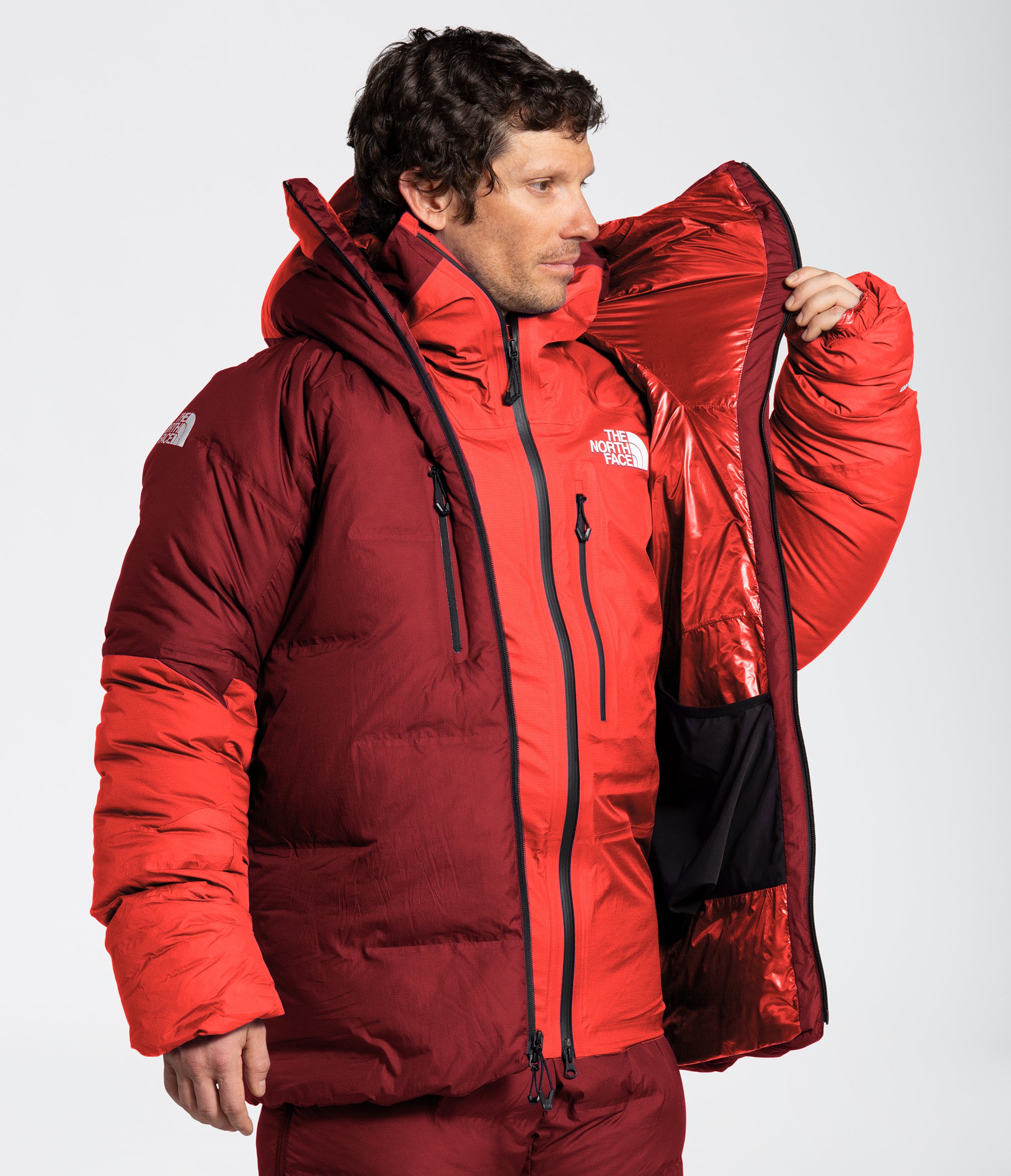 A front-facing upper body image of the Summit Advanced Mountain Kit™ L6 Parka, unzipped.